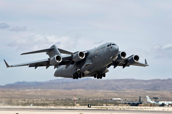 A U.S. Air Force C-17 Globemaster III departs Nellis Air Force Base, Nev., May 18, 2011 during a Mobility Air Forces Exercise. Approximately 40 C-17s and C-130 Hercules aircraft assembled in aerial formations over the Nevada Test and Training Range to conduct air and ground operations as part of the bi-annual, U.S. Air Force Weapons School training event. (U.S. Air Force photo/Airman 1st Class Matthew Lancaster)