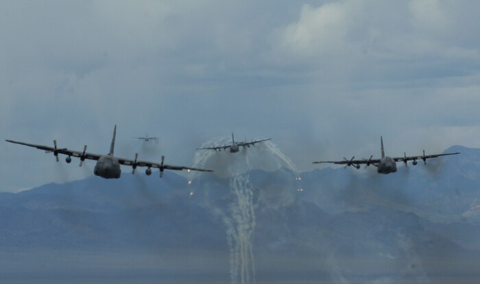 A formation of  U.S. Air Force C-130 Hercules aircraft fly over the Nevada Test and Training Range on May 18, 2011 during a Mobility Air Forces Exercise (MAFEX). More than 40 C-17 Globemaster III and C-130 Hercules cargo aircraft assembled in aerial formations over the Nevada Test and Training Range to conduct air and ground operations as part of the bi-annual U.S. Air Force Weapons School Mobility Air Forces Exercise.
(U.S. Air Force photo/ Master Sgt. Kevin J. Gruenwald)






