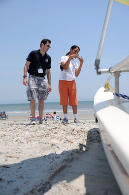 Hilton Head Island, S.C. -- As part of the Yellow Ribbon Program, Esther Wilson took to the beach to try her hand at photography May 21. Guided by Michael Dukes, a public affairs specialist at Charleston Air Force Base, S.C., more than thirty kids learned photography basics and tried their hand at the profession. While the kids were on the beach, their parents were in workshops to learn how to cope with the stresses and demands of having a deployed family member. (U.S. Air Force photo/Staff Sgt. Shawn Rhodes) 
