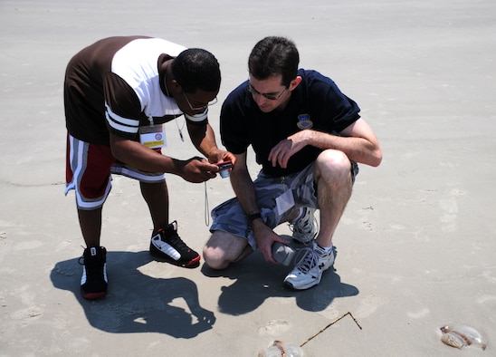 Hilton Head Island, S.C. -- School isn't the only place Simeon Masson learns about the world around him. On May 21, Masson paired up with Michael Dukes, a public affairs specialist at Charleston Air Force Base, to learn photography skills. Masson and more than 30 other family members took to the beach and photographed their environment. The families were there as part of the Yellow Ribbon Program, a workshop sponsored by the Air Force Reserve Command to help families deal with having a loved one deploy. (U.S. Air Force photo/Staff Sgt. Shawn Rhodes)
