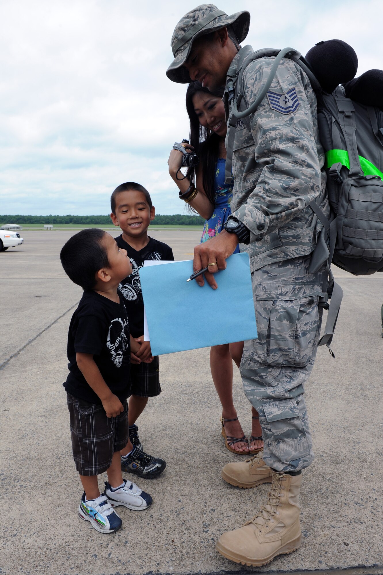 Tech Sgt. Obed Figueroa, a 19th Aircraft Maintenance Squadron crew chief, is greeted by his family on the base flightline May 21, 2011, at Little Rock Air Force Base, Ark. Sergeant Figueroa was one of nearly 200 Airmen that returned home after supporting operations in Southwest Asia. (U.S. Air Force Photo by Airman 1st Class Rusty Frank)