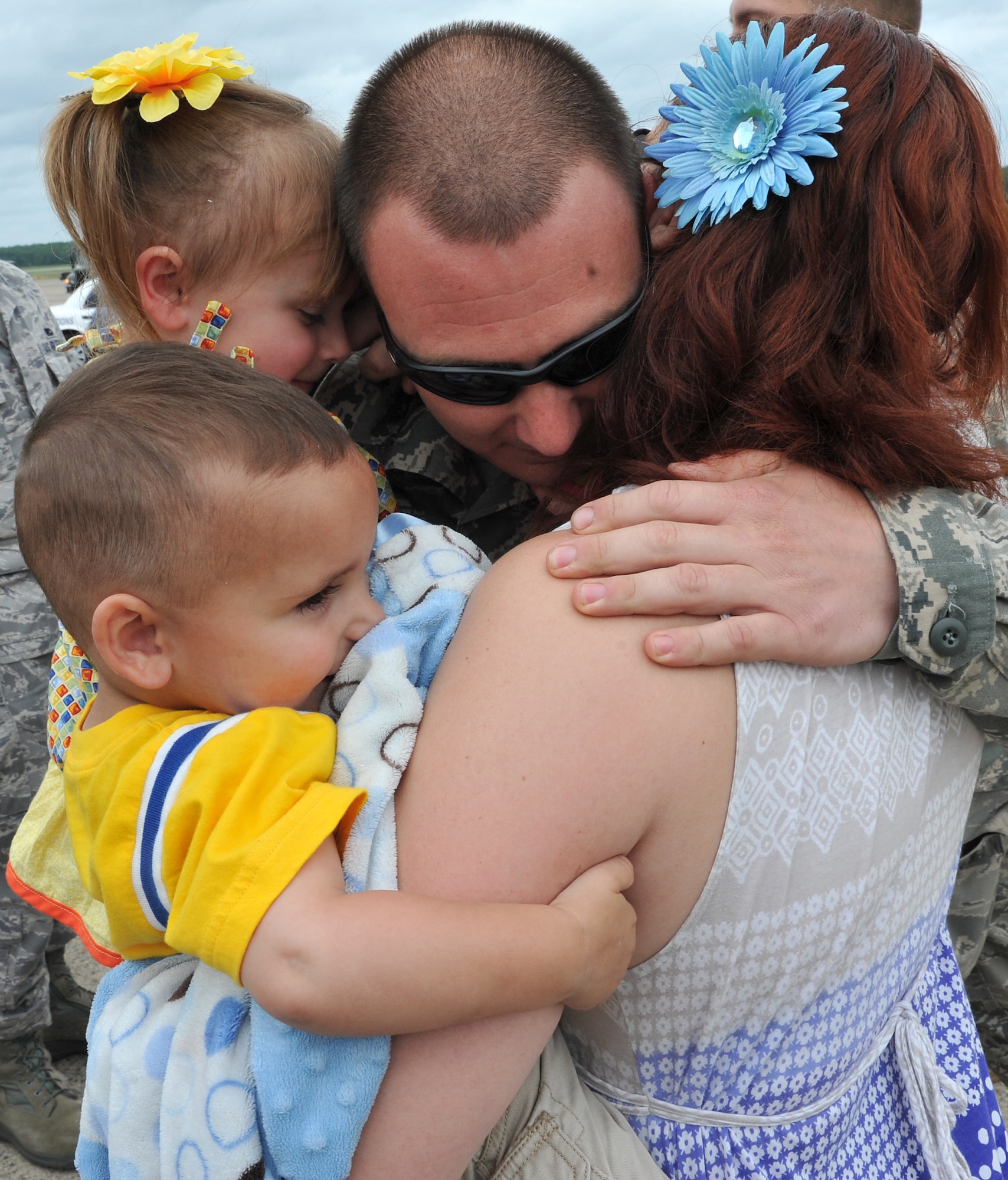 Staff Sgt. Louis Bell, 19th Aircraft Maintenance Squadron crew chief, receives a warm embrace from his family May 21, 2011. Nearly 200 Team Little Rock Airmen reunited with family members and friends Saturday after returning from months of deployments supporting operations in Southwest Asia. (U.S. Air Force photo/Staff Sgt. Chris Willis)