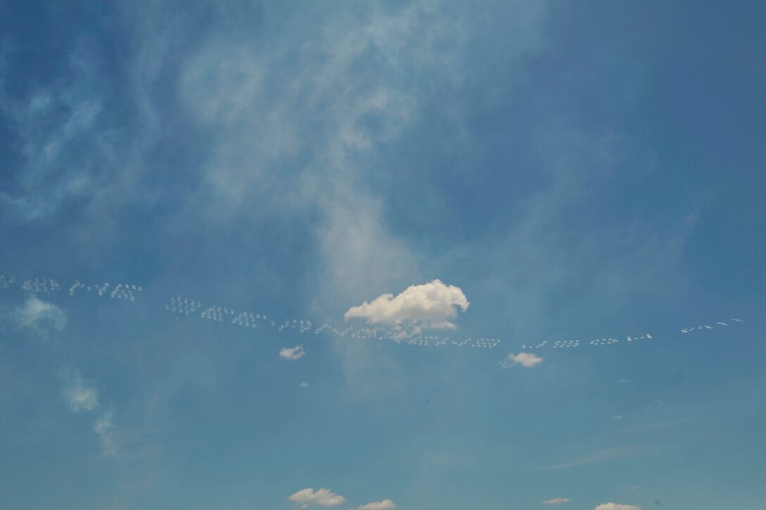 GEICO Skytypers write a message in the sky inviting people around the national capitol region to the 2011 Joint Service Open House here May 21. The JSOH affords the public an opportunity to meet the men and women of the Armed Forces and to see military equipment through the efforts of active duty guard and reserve service members, as well as civilians employees, retirees and family members. (U.S. Air Force photo by Senior Airman Perry Aston) (Released)