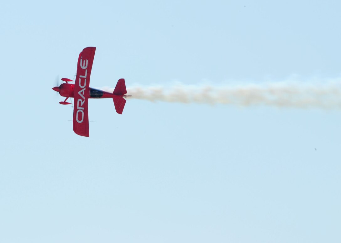 Sean Tucker Oracle preforms an aerial demonstration above the skies of the 2011 Joint Service Open House here May 21. The JSOH affords the public an opportunity to meet the men and women of the Armed Forces and to see military equipment from the Navy, Marines, Army, Air Force and Coast Guard. The JSOH is planned and conduct through the efforts of active duty, guard and reserve servicemembers, as well as civilian employees, retirees and family members. (U.S. Air Force photo/ Staff Sgt. Nichelle Anderson)