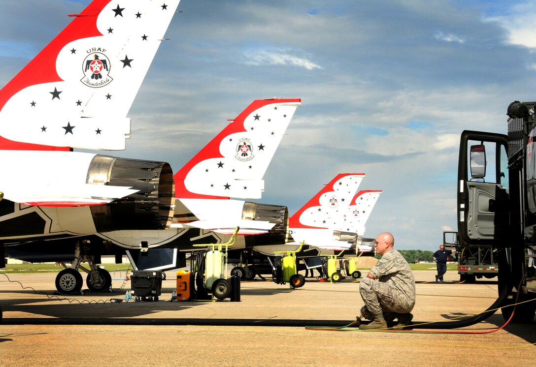 Tech. Sgt. Anthony “Tony” Bowman, 113th Logistics Readiness Squadron Fuels Lab technician, from the D.C. Air National Guard, fuels up an U.S. Air Force Thunderbirds, F-16C Fighting Falcon aircraft with an alternative bio-fuel blend made up of 50 percent camelina-based bio-fuel and 50 percent regular Jet Propellant 8 (JP-8) fuel, while Staff Sgt. Luke Miller, Thunderbird aircraft maintainer, watches. More than 3,000 gallons of bio-fuel was mixed with 3,000 gallons of JP-8 for use by the Thunderbirds for the 2011 Joint Service Open House. The air show will run from May 20 to 22, 2011.  (U.S. Air Force photo by Tech. Sgt. Craig Clapper)