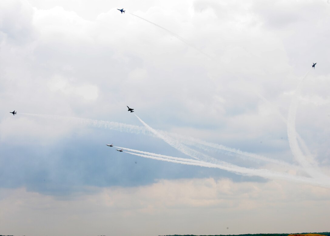 Members of Air Force Thunderbirds Demostration Team use unique precision to execute a manuver in their aerial demostration showing the capabilities of Air Force high performance aicraft during the 2011 Joint Service Open House here May 20. The JSOH affords the public an opportunity to meet the men and women of the Armed Forces and to see military equipment from the Navy, Marines, Army, Air Force, and Coast Guard. The JSOH is planned and conducted through the efforts of active duty,guard, and reserve servicemembers, as well as civilian employees, retirees and family members. (U.S. Air Force photo by Senior Airman Matt Coleman-Foster)