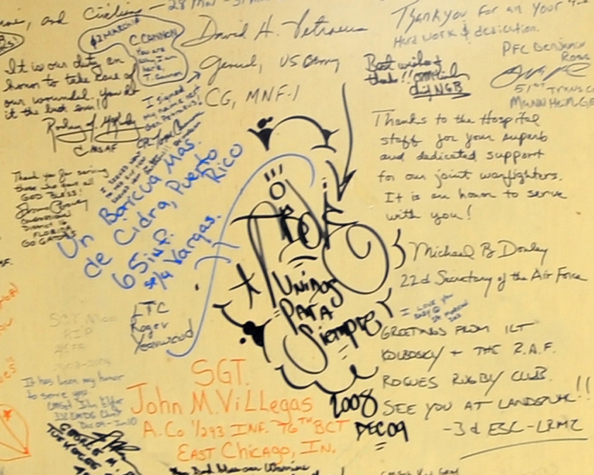 JOINT BASE BALAD, Iraq--Service members left their marks on the walls of the contingency airlift staging facility.  Since the troop surge in 2007, wounded warriors and top military officials have been writing messages as a way to commemorate their fallen comrades. Words of thanks were also left for the JBB hospital staff. (U.S. Air Force photo/Staff Sgt. Keyonna Fennell)