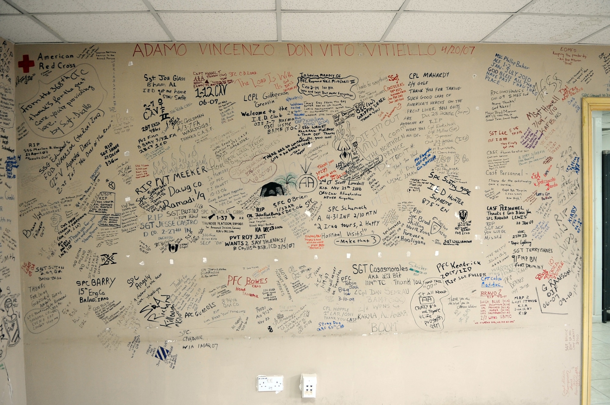 JOINT BASE BALAD, Iraq--Service members left their marks on the walls of the contingency airlift staging facility.  Since the troop surge in 2007, wounded warriors and top military officials have been writing messages as a way to commemorate their fallen comrades. Words of thanks were also left for the JBB hospital staff. (U.S. Air Force photo/Staff Sgt. Keyonna Fennell)