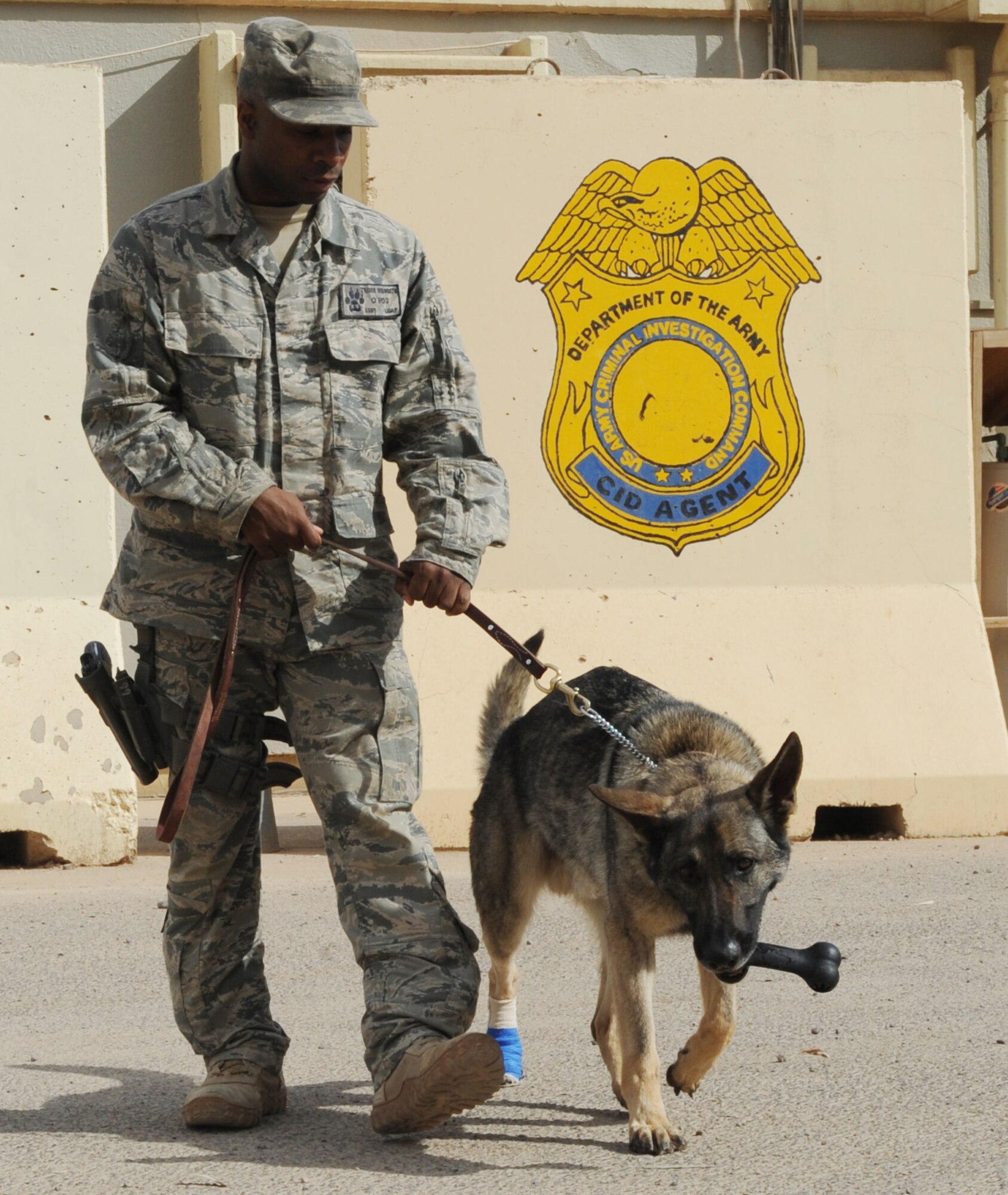 JOINT BASE BALAD, Iraq--Staff Sgt. Travis Dulworth, 332nd Expeditionary Security Forces Squadron K9 handler, takes his dog, Andor, for a walk May 12, 2011. Sergeant Dulworth is a native of Frederick, Md., and is deployed from McConnell Air Force Base, Kan. (U.S. Air Force photo/Staff Sgt. Keyonna Fennell)