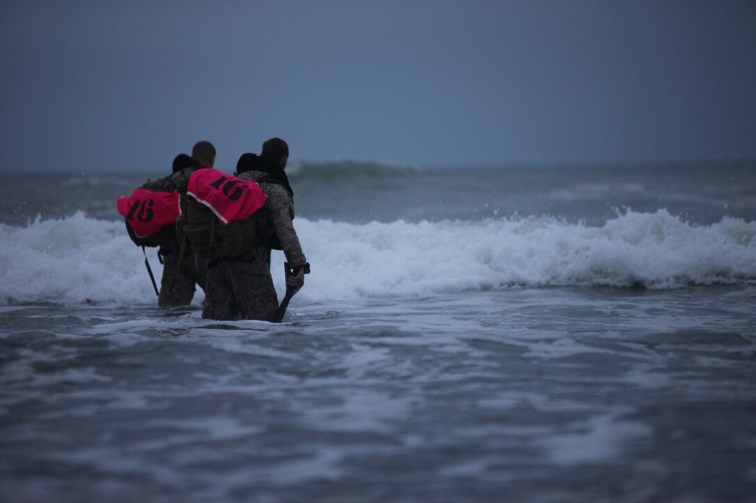(Left to right) Gunnery Sgt. Collin Barry and Gunnery Sgt. Ryan Cullen prepare to swim 2,000 meters in Camp Pendleton’s Red Beach during the 3rd Annual Recon Challenge, May 21. During the two-man team challenge, which began at 4 a.m., the 18 teams of Recon Marines fearlessly hiked up some of the base’s most intense hills, swam through ice-cold waters, conquered the Corps’ traditional obstacle course, conducted circuit course exercises and then finally displayed what every Marine is known for, marksmanship.