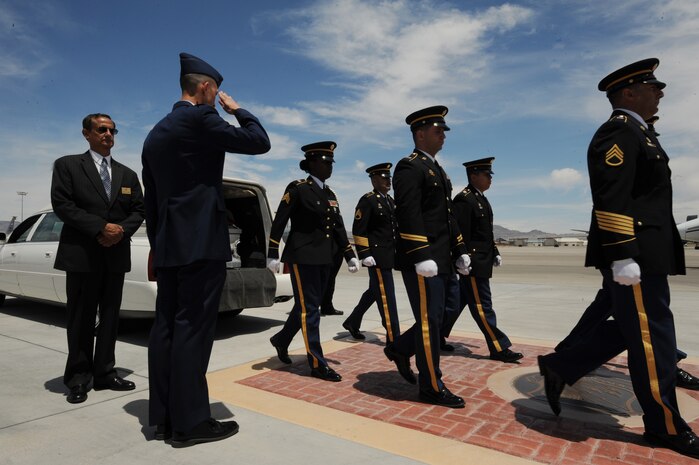 NELLIS AIR FORCE BASE, Nev.-- A U.S. Army pallbearer team departs following the transfer of the remains of Army Sgt. Ken Hermogino, at Nellis Air Force Base, Nev., May 21, 2011. Sergeant Hermogino died May 9 in Herat province, Afghanistan, of injuries sustained in a non-combat related vehicle accident. Sergeant Hermogino graduated from Basic High School in Las Vegas in 1998 and, prior to transitioning to the U.S. Army in 2009, he served eight years in the U.S. Air Force as a medical administrator. He will be laid to rest with full military honors at the Southern Nevada Veterans Memorial Cemetery in Boulder City. (U.S. Air Force photo/ Master Sgt. Kevin J. Gruenwald)

