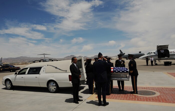 NELLIS AIR FORCE BASE, Nev.-- A U.S. Army pallbearer team transfers the remains of Army Sgt. Ken Hermogino, at Nellis Air Force Base, Nev., May 21, 2011. Sergeant Hermogino died May 9 in Herat province, Afghanistan, of injuries sustained in a non-combat related vehicle accident. Sergeant Hermogino graduated from Basic High School in Las Vegas in 1998 and, prior to transitioning to the U.S. Army in 2009, he served eight years in the U.S. Air Force as a medical administrator. He will be laid to rest with full military honors at the Southern Nevada Veterans Memorial Cemetery in Boulder City. (U.S. Air Force photo/ Master Sgt. Kevin J. Gruenwald) 



