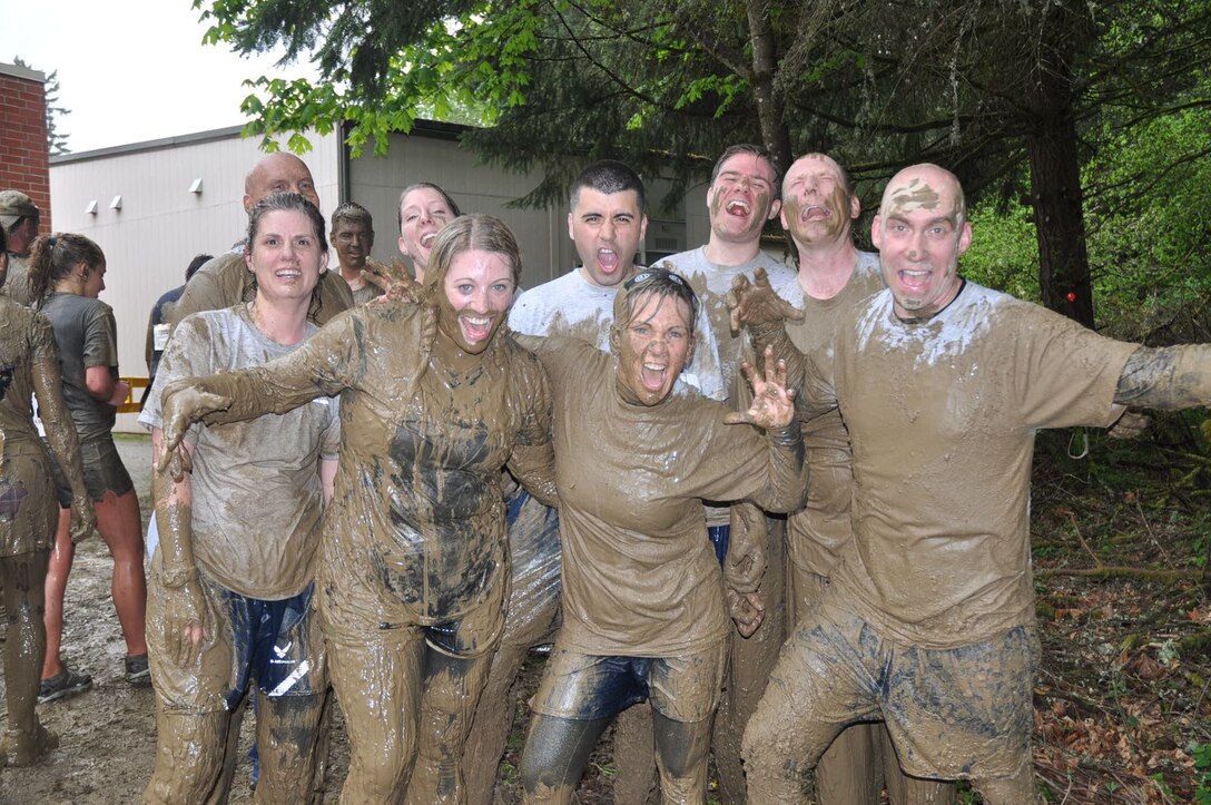 "AHHHHH!!" cry the muddy warriors of the 446th Airlift Wing Saturday after running the 6th Annual Down and Dirty Mud Run.  They ran through the river, and through the woods, they did not stop at grandma's house, but dove face first in the mud instead.  (U.S. Air Force photo by 2nd Lt. Denise Hauser/Released)