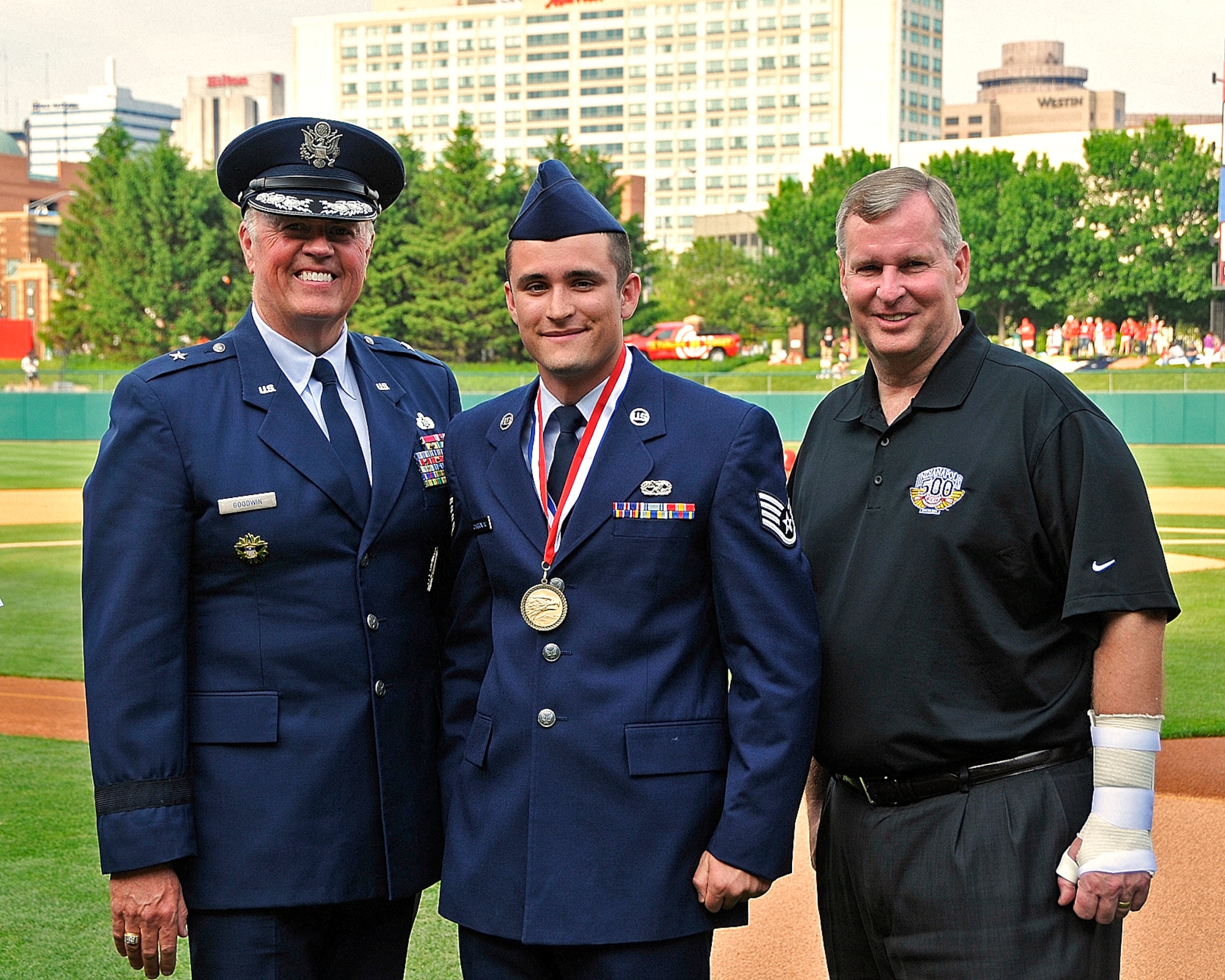 Indiana Air National Guard Staff Sgt. Andrew Carboneau poses with Brigadier General Stewart Goodwin, Assistant Adjutant General - Air, Indiana National Guard, and Mayor Greg Ballard, mayor of Indianapolis, Ind. on Victory Field, home of the Indianapolis Indians, in Indianapolis, Ind. on May 20, 2011.  Carboneau was just awarded Airman of the Year for 2010 for the Indiana Air National Guard and was being presented the award at the Armed Forces Day Picnic.  Photo by Indiana Air National Guard Staff Sgt. Justin Goeden. RELEASED