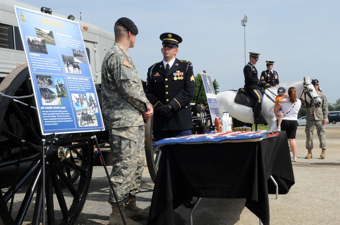 Members of the Old Guard give spectators a taste of what it takes to guard the tomb of the unknown solider and other important jobs at the 2011 Joint Service Open House here May 22. The JSOH affords the public an opportunity to meet the men and women of the Armed Forces and see military equipment from the Navy, Marines, Army, Air Force and Coast Guard. The JSOH is planned and conducted through the efforts of active duty, guard and reserve servicemembers, as well as civilian employees, retirees and family members. (U.S. Air Force photo by Senior Airman Melissa V. Brownstein)