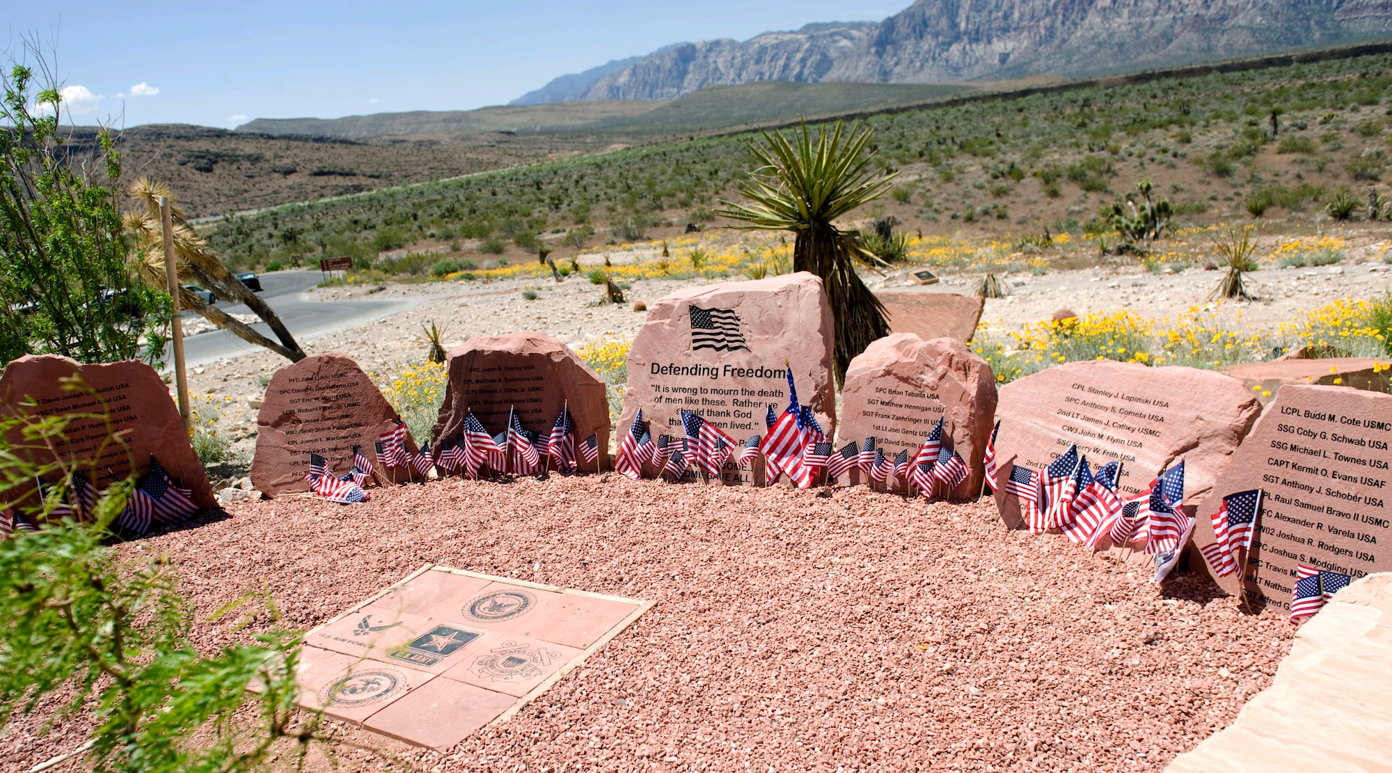 LAS VEGAS -- The Defending Freedom Memorial is located at the Red Rock National Conservation Area in Las Vegas.  The memorial was initially dedicated in 2005 and is comprised of seven sandstones with the engraved names of Nevada's fallen servicemen and women. In 2011, the names Nellis Airmen Senior Airman Michael Buras, Staff Sgt. David Smith, 1st Lt. Joel Gentz and Capt. David Wisniewski were added to the memorial. All four Airmen were lost in 2010 while supporting operations in Afghanistan.  (U.S. Air Force photo by Airman 1st Class Jamie L. Nicley)
