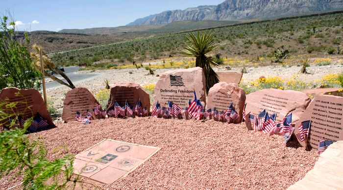 LAS VEGAS -- The Defending Freedom Memorial is located at the Red Rock National Conservation Area in Las Vegas.  The memorial was initially dedicated in 2005 and is comprised of seven sandstones with the engraved names of Nevada's fallen servicemen and women. In 2011, the names Nellis Airmen Senior Airman Michael Buras, Staff Sgt. David Smith, 1st Lt. Joel Gentz and Capt. David Wisniewski were added to the memorial. All four Airmen were lost in 2010 while supporting operations in Afghanistan.  (U.S. Air Force photo by Airman 1st Class Jamie L. Nicley)
