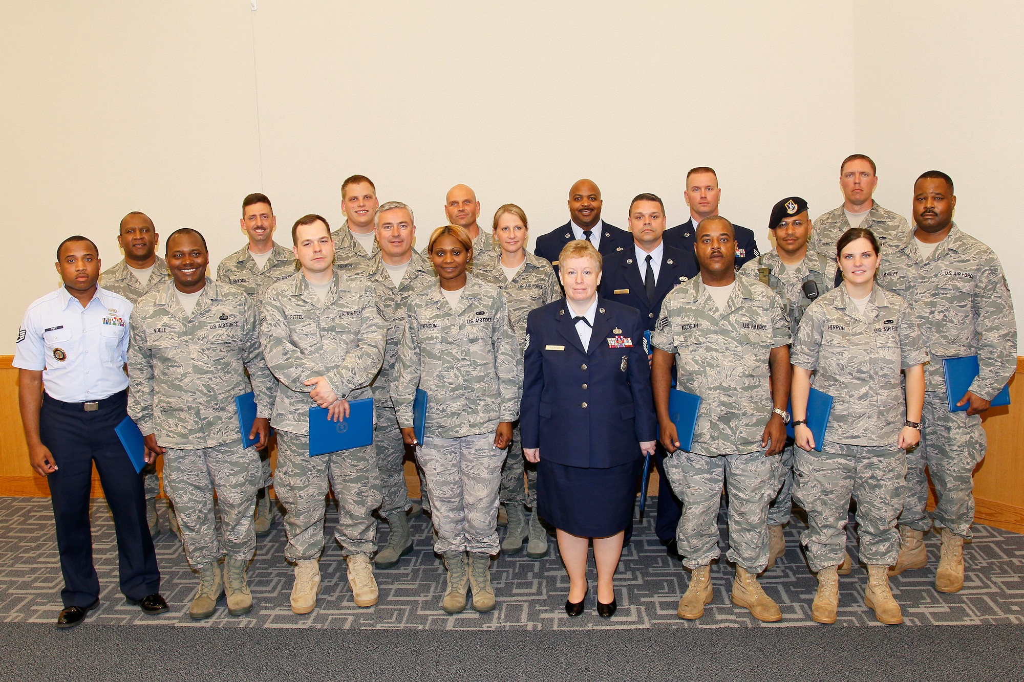 Airmen from the 127th Wing, Michigan Air National Guard, who graduated from the Community College of the Air Firce gather for a group photo on May 22, 2011, at Selfridge Air National Guard Base, Mich. The CCAF allows Airmen to combine military and civilian education to work toward an associate degree in their military career field. (U.S. Air Force photo by MSgt. Terry Atwell) (Released)