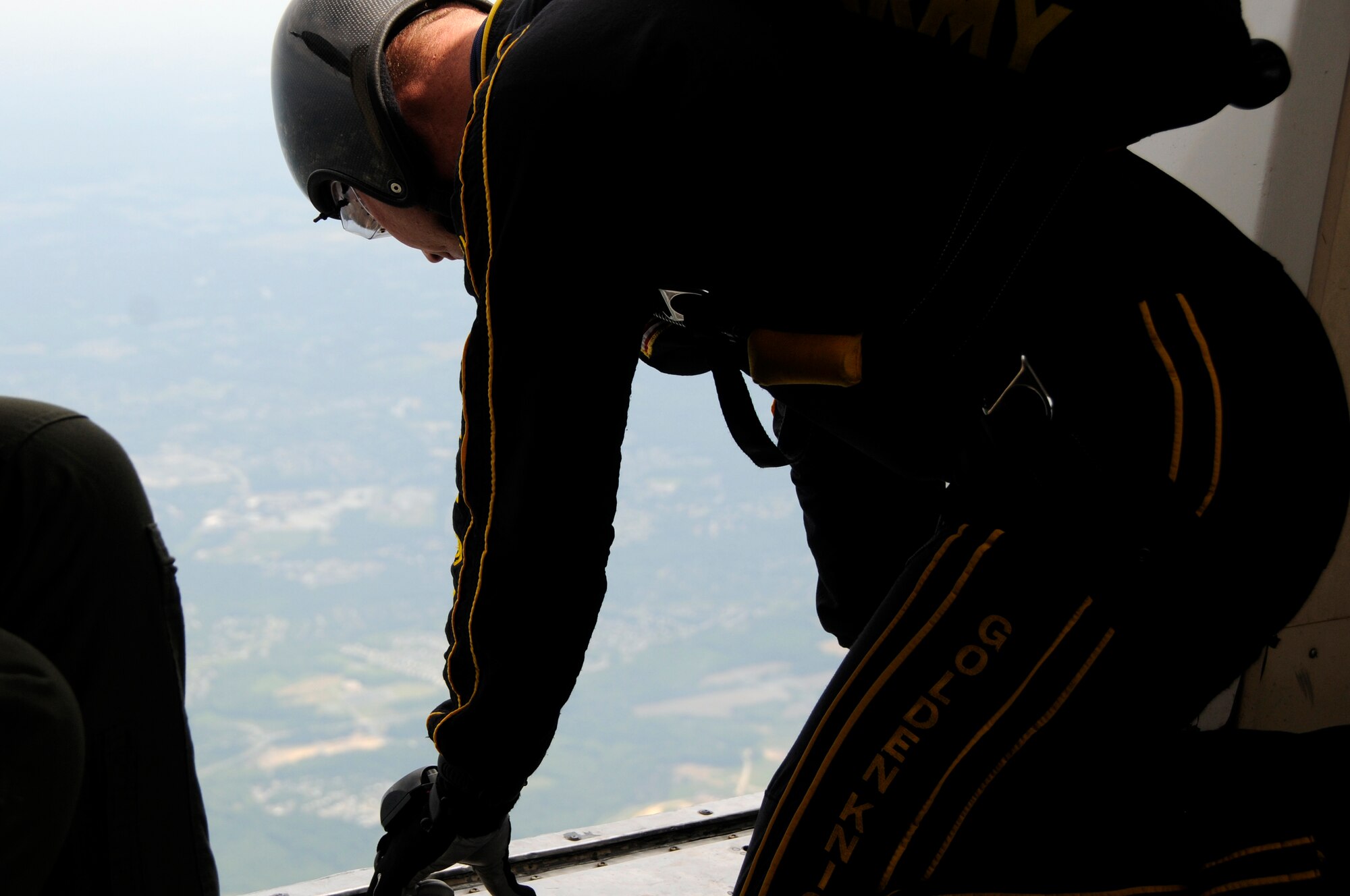 A member of the U.S. Army Golden Knights observes the sky to determine the jumping altitude before jumping here during the 2011 Joint Service Open House May 22. The JSOH affords the public an opportunity to meet the men and women of the Armed Forces and to see the military equipment from the Navy, Marines, Army, Air Force and Coast Guard. JSOH is a planned and conducted through the efforts of active duty, guard and reserve service members, as well as civilian employees, retirees and family members. (U.S. Air Force photo by Airman 1st Class Tabitha N. Haynes) 