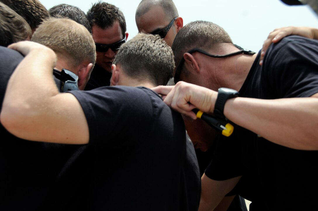 The U.S. Army's Golden Knights parachute demontstration team rally together before their performance at the 2011 Joint Service Open House here May 22. The JSOH affords the public an opportunity to meet the men and women of the Armed Forces and to see the military equipment from the Navy, Marines, Army, Air Force and Coast Guard. The JSOH is a planned and conducted through the efforts of active duty, guard and reserve servicemembers, as well as civilian employees, retirees and family members. (U.S. Air Force photo by Airman 1st Class Tabitha N. Haynes) 