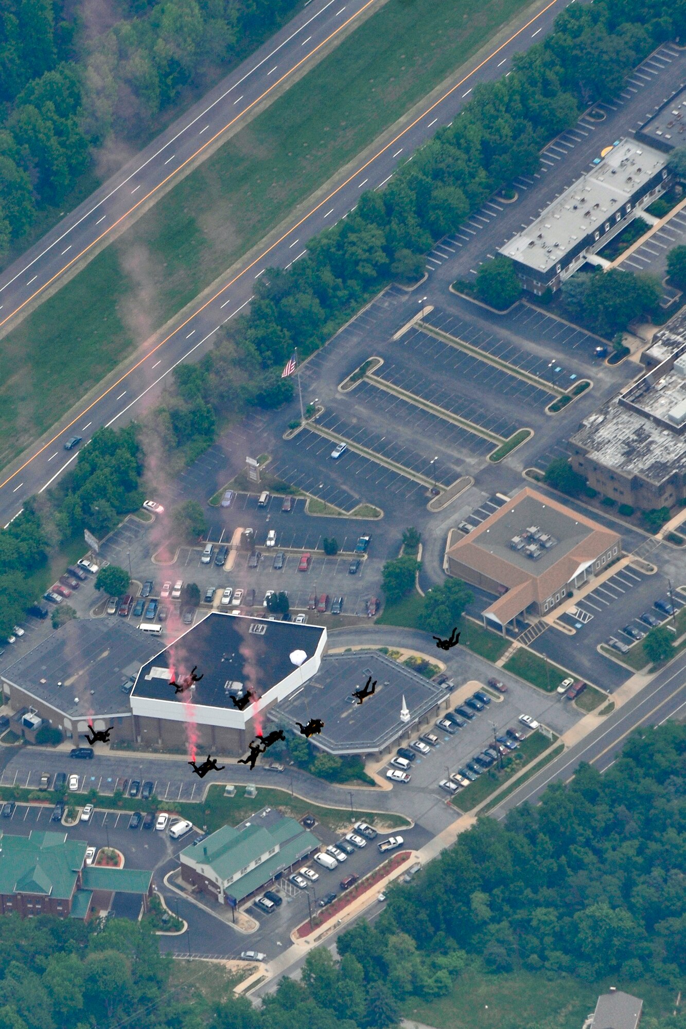 The U.S. Army Golden Knights perform precision skydiving during the 2011 Joint Service Open House here May 21. The 2011 JSOH affords the public an opportunity to meet the men and women of the Armed Forces and to see military equipment through the efforts of active duty guard and reserve servicemembers, as well as civilians employees, retirees and family members. (U.S. Air Force photo by Senior Airman Perry Aston)