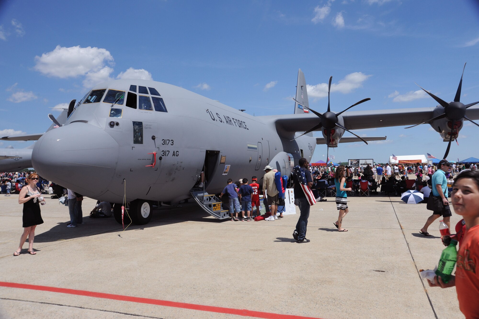 Guests at the 2011 Joint Service Open House admire the C-130J display here May 21. The JSOH affords the public an opportunity to meet the men and women of the Armed Forces and to see military equipment from the Navy, Marines, Army, Air Force and Coast Guard. The JSOH is planned and conducted through the efforts of active duty, guard and reserve servicemembers, as well as civilian employees, retirees and family members. (U.S. Air Force photo by Senior Airman Torey Griffith)