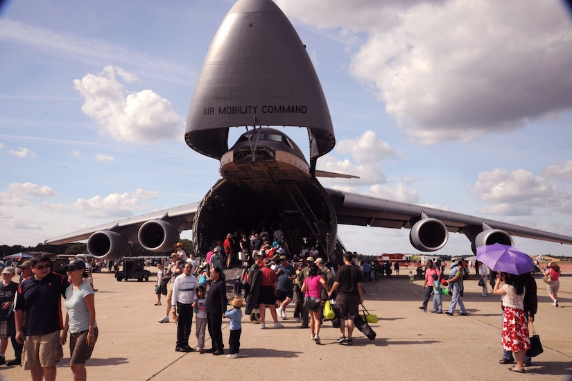 A hungry C-5 Galaxy swallows visitors attending the 2011 Joint Service Open house May 21. The JSOH affords the public an opportunity to meet the men and women of the Armed Forces and to see military equipment from the Navy, Marines, Army, Air Force and Coast Guard. The JSOH is planned and conducted through the efforts of active duty, guard and reserve servicemembers, as well as civilian employees, retirees and family members.(U.S. Air Force photo by Senior Airman Torey Griffith)