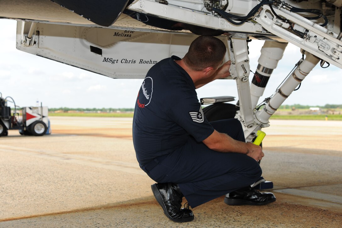 Technical Sgt. Eric McLaren conducts post performance inspection and maintenance on the #1 aircraft for the U.S. Air Force Thunderbirds flight demonstration team May 21. The JSOH affords the public an opportunity to meet the men and women of the Armed Forces and to see military equipment from the Navy, Marines, Army, Air Force and Coast Guard. The JSOH is planned and conducted through the efforts of active duty, guard and reserve servicemembers, as well as civilian employees, retirees and family members.  (U.S. Marine Corps photo)