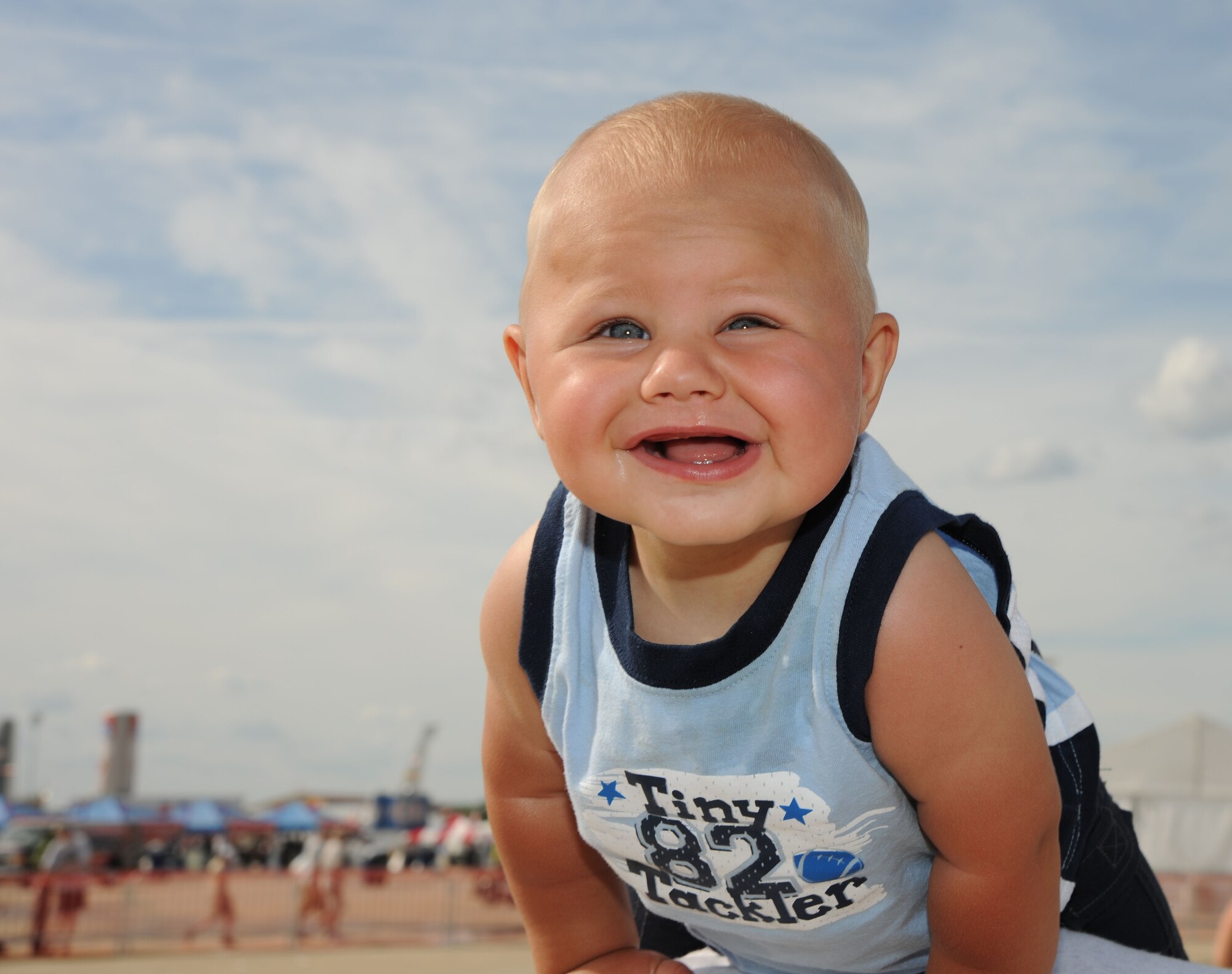Dakota Moore enjoys himself at his first air show here at the 2011 Joint Service Open House May 21. The JSOH affords the public an opportunity to meet the men and women of the Armed Forces and to see military equipment from the Navy, Marines, Army, Air Force and Coast Guard. The JSOH is planned and conducted through the efforts of active duty, guard and reserve servicemembers, as well as civilian employees, retirees and family members. (U.S. Marine Corps. photo)