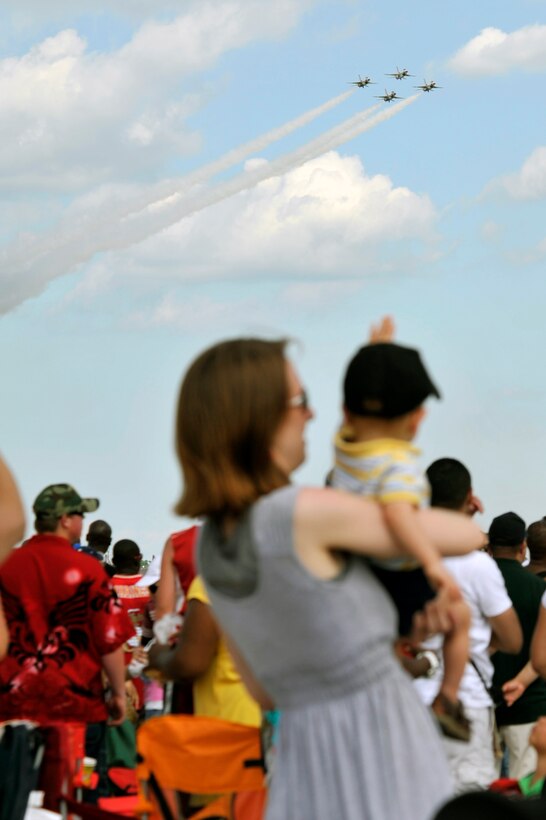 The Thunderbirds perform for a crowd of approximately 100,000 people during the 2011 Joint Service Open House here May 21. The JSOH affords the public an opportunity to meet the men and women of the Armed Forces and to see military equipment through the efforts of active duty, guard and reserve servicemembers, as well as civilians employees, retirees and family members. (U.S. Air Force photo by Senior Airman Perry Aston) 