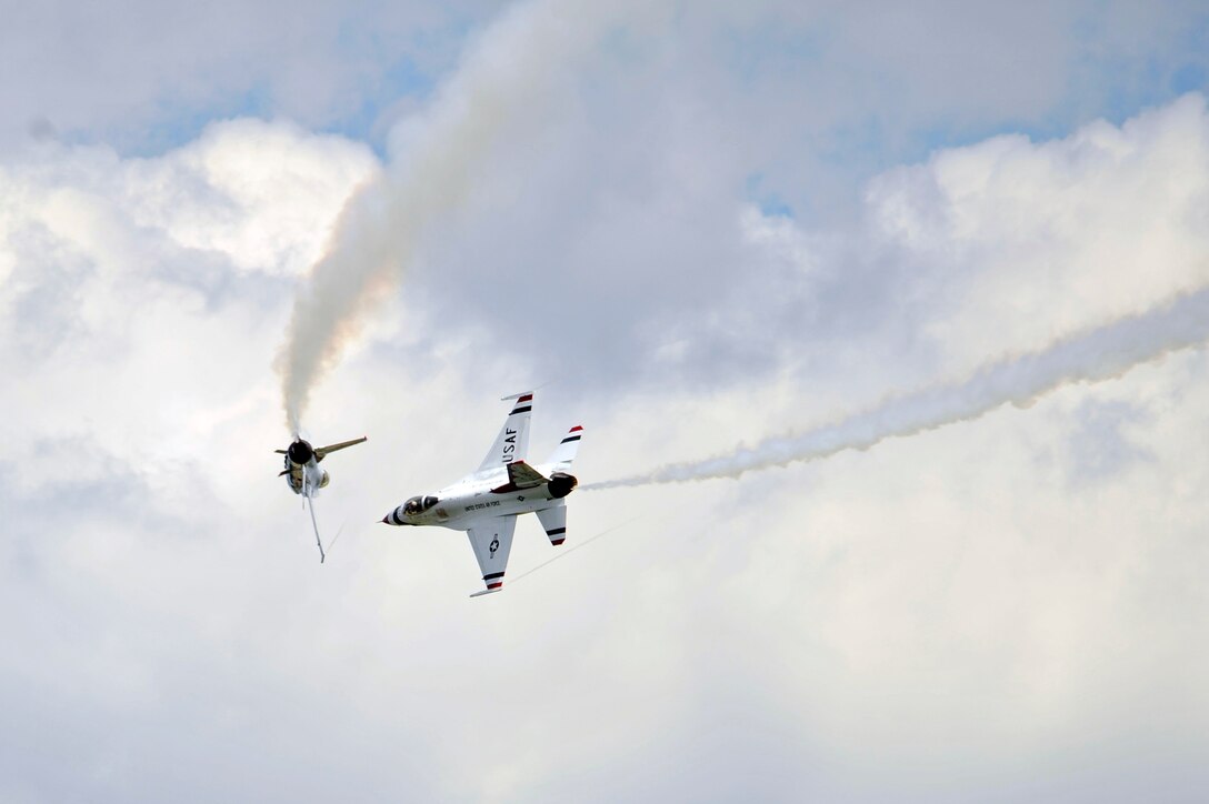 The Air Force premier demonstration squadron, The Thunderbirds, perform precision aerobatics during the 2011 Joint Service Open House here May 21. The JSOH affords the public an opportunity to meet the men and women of the Armed Forces and to see military equipment through the efforts of active duty, guard and reserve servicemembers, as well as civilians employees, retirees and family members. (U.S. Air Force photo by Senior Airman Perry Aston) 