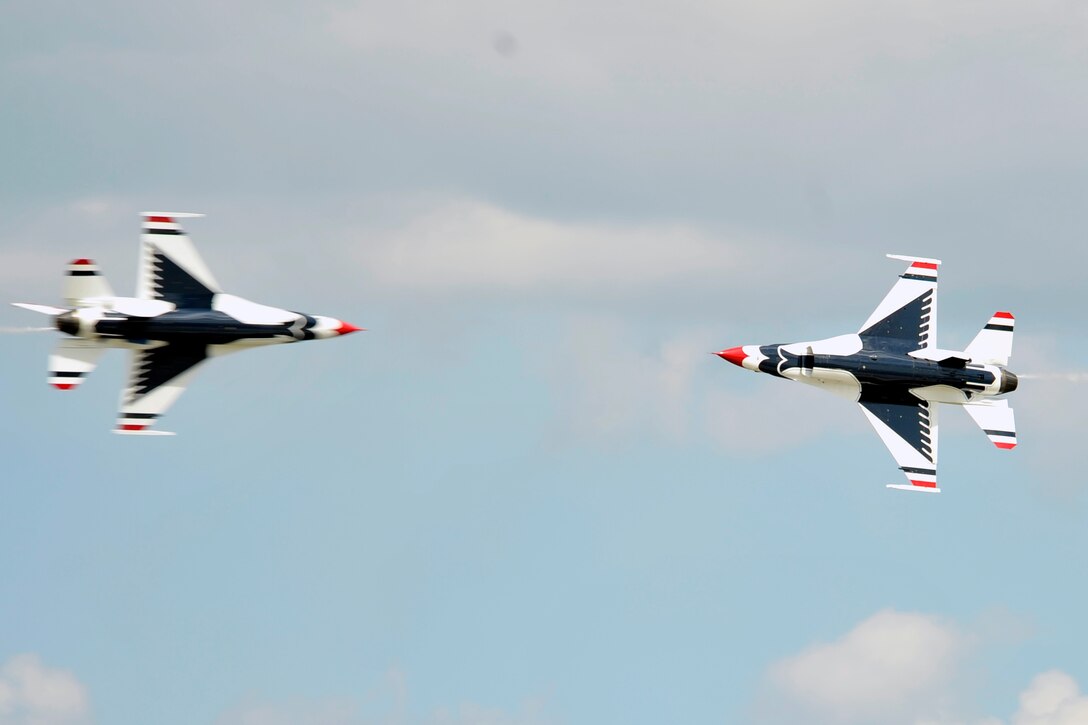 The Air Force premier demonstration squadron, The Thunderbirds, perform precision aerobatics during the 2011 Joint Service Open House here May 21. The JSOH affords the public an opportunity to meet the men and women of the Armed Forces and to see military equipment through the efforts of active duty, guard and reserve servicemembers, as well as civilians employees, retirees and family members. (U.S. Air Force photo by Senior Airman Perry Aston) 