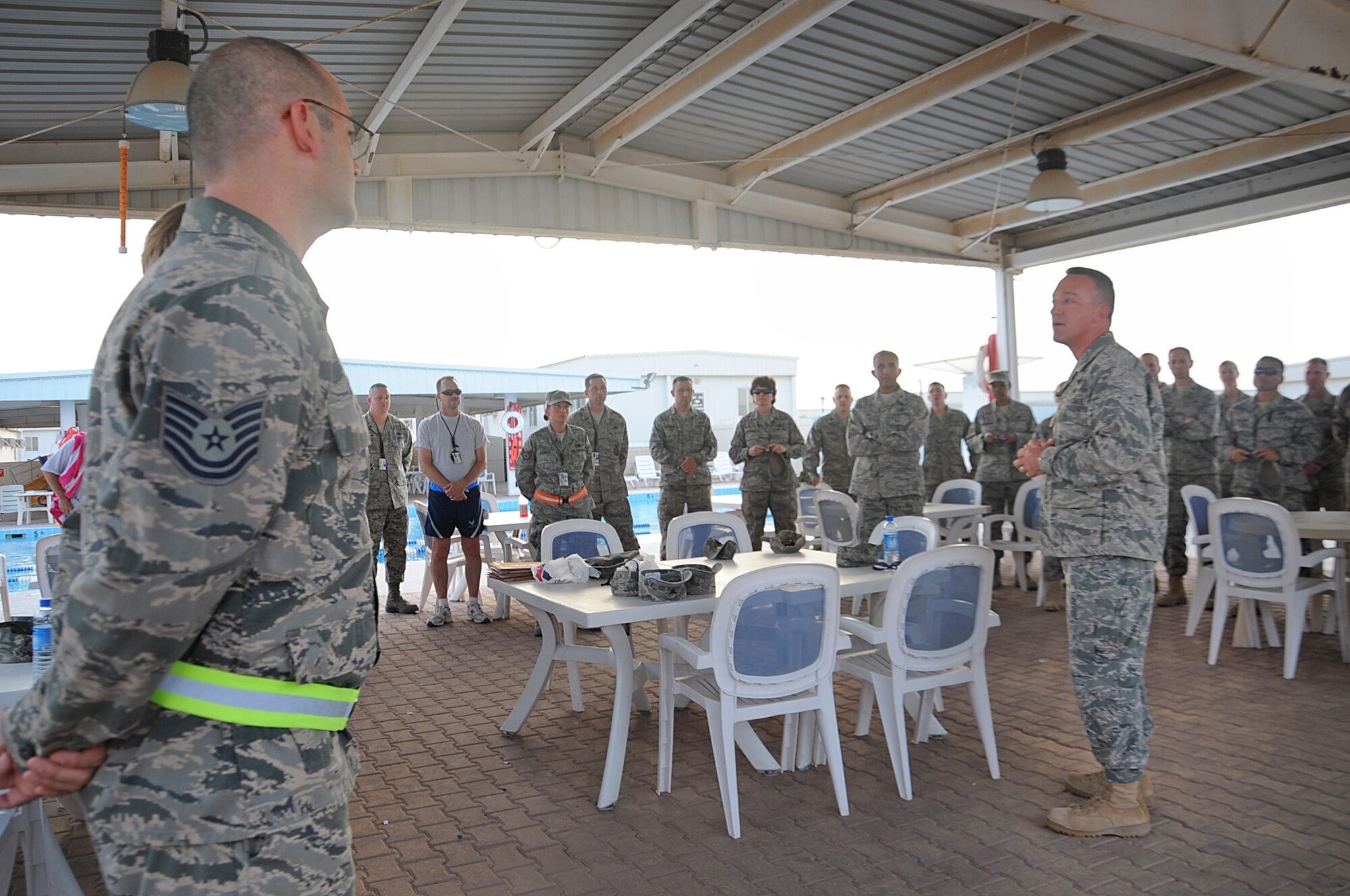 Col. Patrick X. Mordente, 386th Air Expeditionary Wing commander, congratulates newly selected master sergeants during their deployment to the 386th AEW. (U.S. Air Force photo by Senior Airmen Cynthia Spalding)