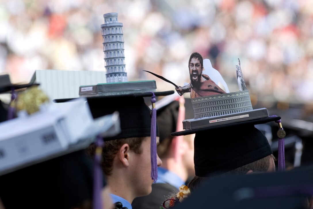 University of Notre Dame architecture graduates display their creative designs on top of their caps during the school's commencement ceremony in South Bend, Ind., May 22, 2011.
