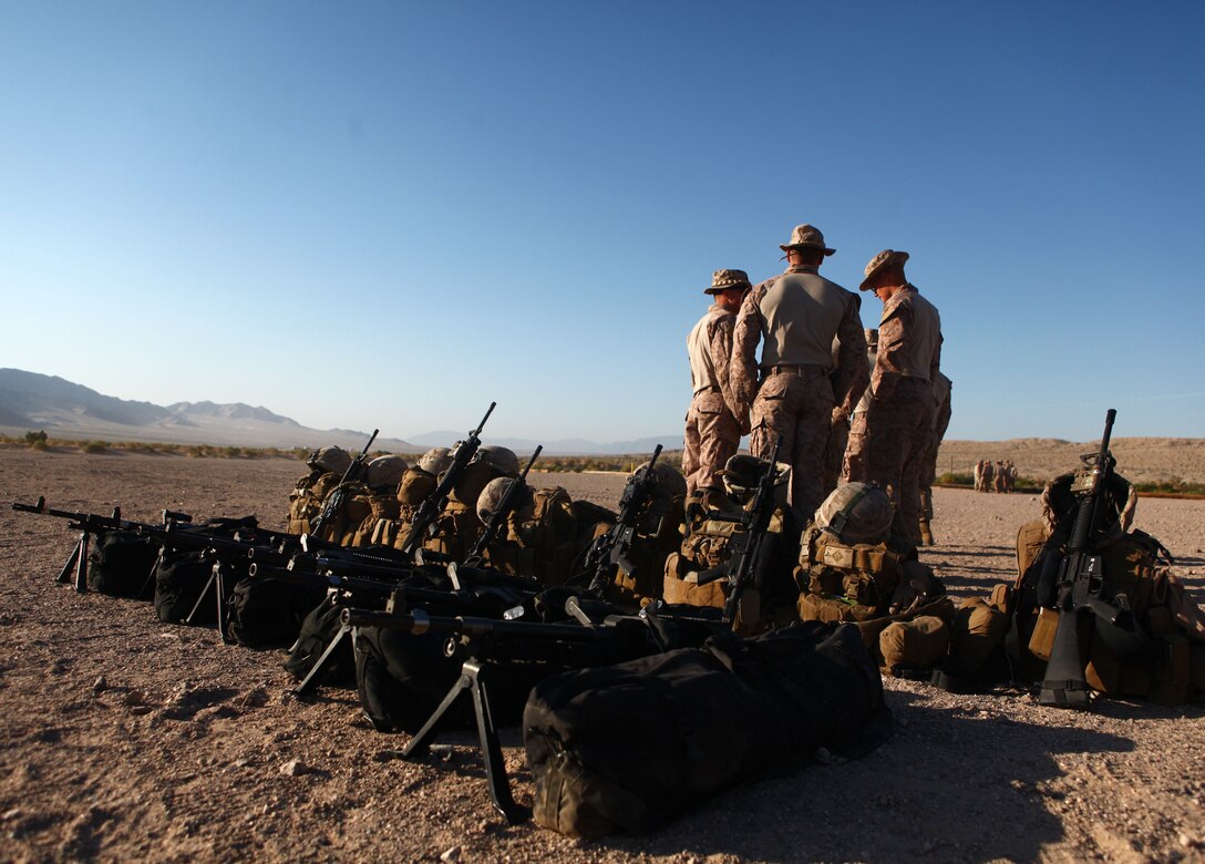 Marines with Weapons platoon, Company B, 1st Battalion, 6th Marine Regiment, 2nd Marine Division, stage their equipment prior to a machine-gun range at Marine Corps Base 29 Palms, Calif., May 23, 2011.  The Marines and sailors of 1/6 are taking part in the Enhanced Mojave Viper exercise, a large-scale predeployment training event aimed at preparing the battalion for their upcoming deployment to Afghanistan.