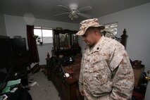Staff Sgt. Neville Shiwdin stands in the bedroom of his family's home in Joplin, Mo. May 23 after it's destruction by a tornado the night before. During the tornado, Shiwdin struggled to keep the door closed on their home's closet where he, his wife and kids took shelter. Shiwdin is a recruiter at Recruiting Sub Station Joplin, Recruiting Station Kansas City.