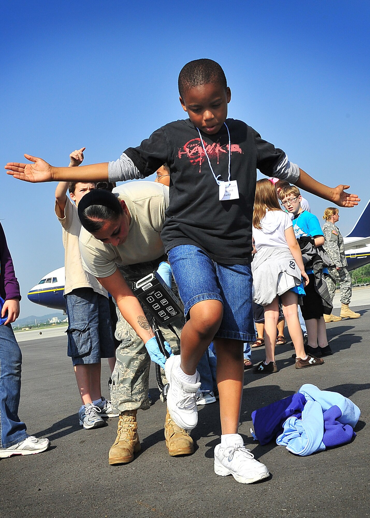 During an Emergency Management Exercise, Osan responders practiced a newly drafted humanitarian evacuation plan ‘Operation Tomdachi’ here May 23.  The scenario was fairly familiar…Japan experienced a devastating earthquake making it necessary for the Japanese people and Americans stationed in Japan to evacuate the region.  A plane full of Japanese and Americans stationed in Japan were simulated by kids from Osan Middle School.   The kids were armed with bags of simulated vomit and symptom cards placed around their neck, to exercise the processing line.   (U.S. Air Force Photo by/Staff Sgt. Daylena Gonzalez)