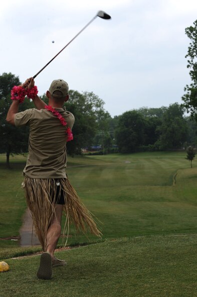 Capt. Daniel Minnocci, 2nd Security Forces Squadron, drives a golf ball at the Fox Run Golf Course on Barksdale Air Force Base, La., May 20. Participants who wore skirts were given a distance advantage. The Airmen and civilian workers of the 2 SFS gathered to celebrate National Police Week, enacted by President Kennedy in 1962, to honor all law enforcement officers lost in the line of duty. (U.S. Air Force photo/Airman 1st Class Micaiah Anthony)(RELEASED)