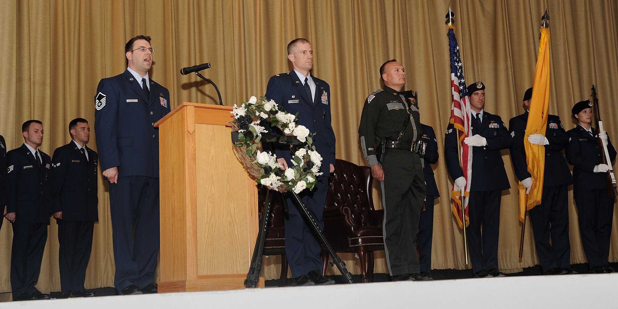 U.S. Air Force Master Sgt. Malcolm Cowart, 27th Special Operations Security Forces Squadron, sings the National Anthem at Cannon Air Force Base, N.M., May 20, 2011.  Police Week is held annually to honor fallen members of the civilian and military police work-force.  (U.S. Air Force photo by Senior Airman James Bell) 