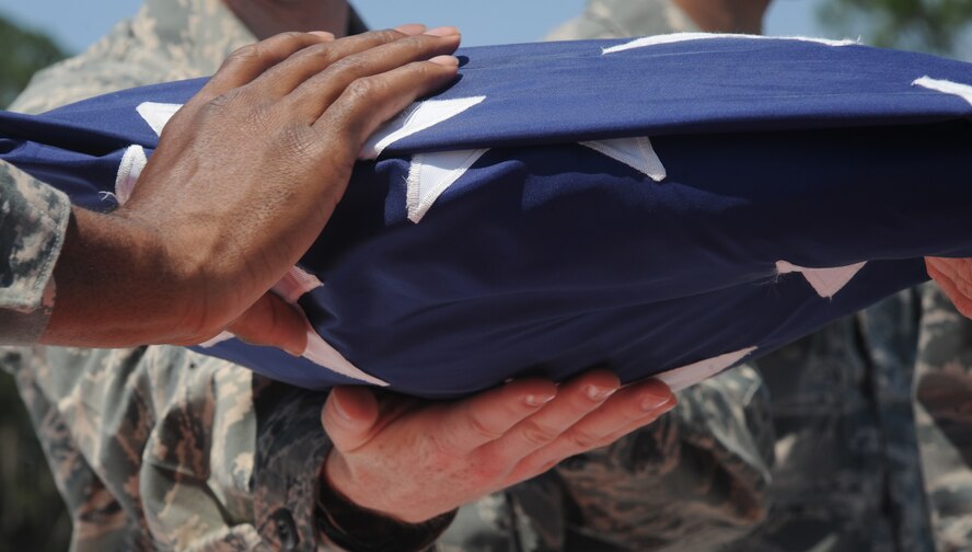 MOODY AIR FORCE BASE, Ga. -- Students of Senior Airman Jason D. Cunningham Airman Leadership School Class 11-E retire the American flag May 20 during a dedication ceremony for the President George W. Bush Air Park at Moody Field. The air park displays the heritage of the Flying Tigers through static aircraft displays featuring aircraft flown in conflicts from World War II to the present. (U.S. Air Force photo/Airman 1st Class Paul Francis)(RELEASED)