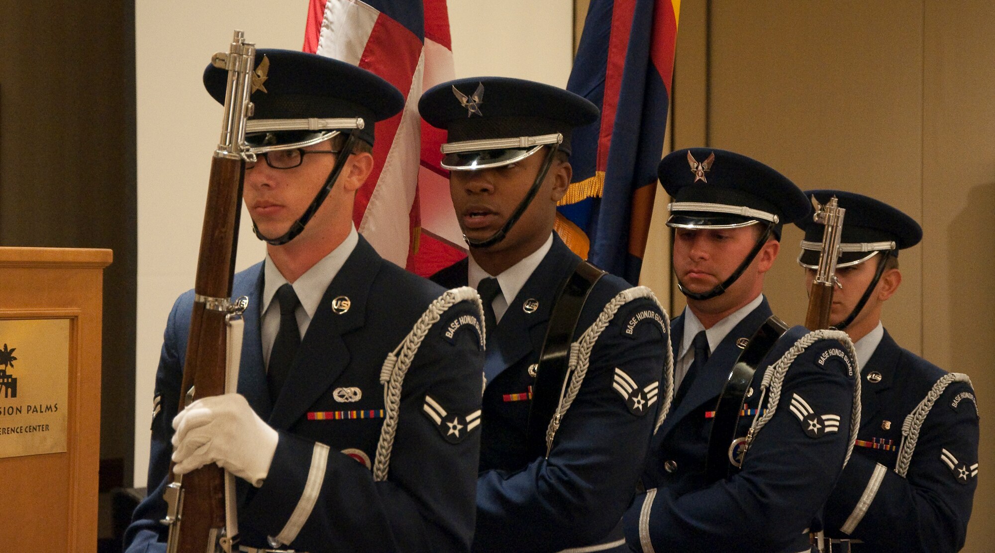 Luke Air Force Base Honor Guard Members post the Colors at the beginning of the western regional Yellow Ribbon Event, May 14-15 at the Tempe Mission Palms Resort in Tempe, Ariz. The event provided Reservists, Guardsmen and their families with information and tools necessary for successful deployments. (U.S. Air Force Photo/Staff Sgt. Erin Smith)