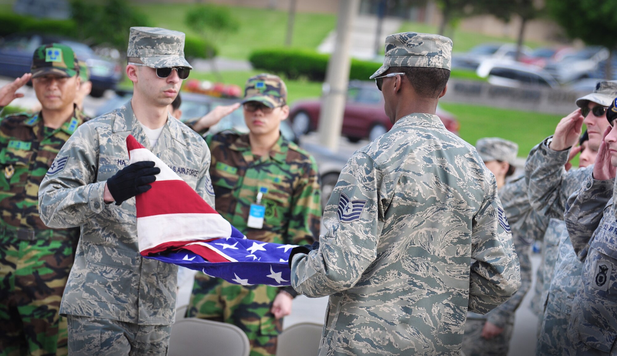 Airmen celebrated National Police Week with a ceremonial retiring of two Airmen who were killed in the line of duty and other events at Osan Air Base, South Korea. In 1962, President John F. Kennedy signed a proclamation which designated May 15 as Peace Officers Memorial Day and the week in which that date falls as Police Week. Thousands of law enforcement agencies around the world celebrate the week to remember those who have been killed in the line of duty. (U.S. Air Force photo/Staff Sgt. Chad Thompson) 
