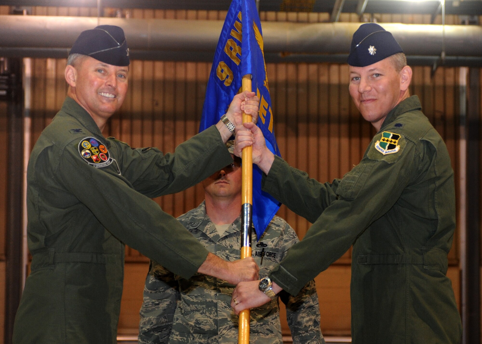 Lt. Col. Scott J. West receives the Detachment 1, 9th Reconnaissance Wing guideon from Col. Lawrence M. Hoffman, 9th Operations Group, 9th RW commander during a change of command ceremony May 23, 2011. (U.S. Air Force photo by Airman 1st Class Amber Bennett