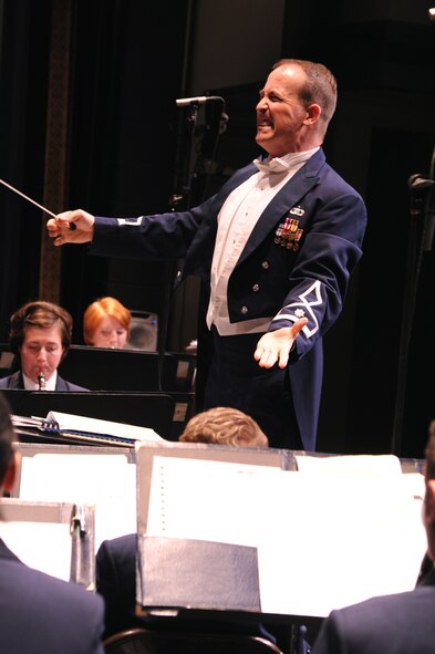 SEYMOUR JOHNSON AIR FORCE BASE, N.C.- Major Jeffery Warner conducts the U.S. Air Force Heritage of America Band performance at the Paramount Theater  in Goldsboro, May 19, 2011. The band was created by order of the Secretary of War Oct. 1, 1941. The band is stationed at Langley Air Force Base, Va. Major Warner is the regional band commander and is a native of St Cloud, Fl. (U. S. Air Force photo/Senior Airman Whitney Lambert)