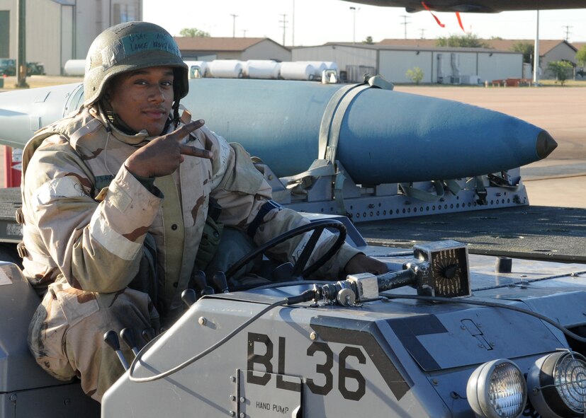 Dyess Air Force Base, Texas--Exercise..Exercise..Exercise Airman 1st Class Lance Kroninger, 7th Expeditionary Aircraft Maintenance Squadron, displays the number seven here May 16. The symbol seven represents the 7th Air Expeditionary Wing’s BE ONE TEAM, B-1 FIGHT slogan. The 7th AEW’s mission is to provide world class Airmen and airpower for the warfighter. (U.S. Air Force photo/ Airman 1st Class Jenifer H. Calhoun)