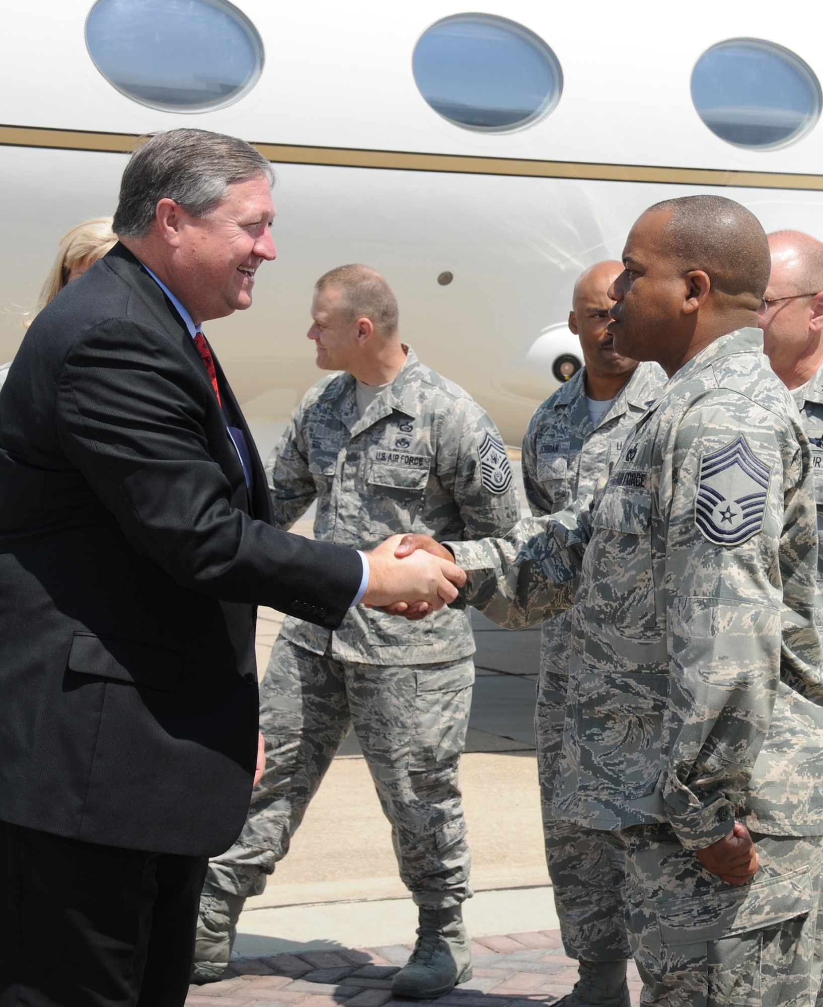 Secretary of the Air Force Michael Donley, left, is greeted by the 81st Training Wing's acting command chief, Chief Master Sgt. Curtis Jennings, during the secretary's visit to Keesler Thursday.  Secretary Donley was accompanied by Chief Master Sgt. of the Air Force James Roy.  (U.S. Air Force photo by Kemberly Groue)