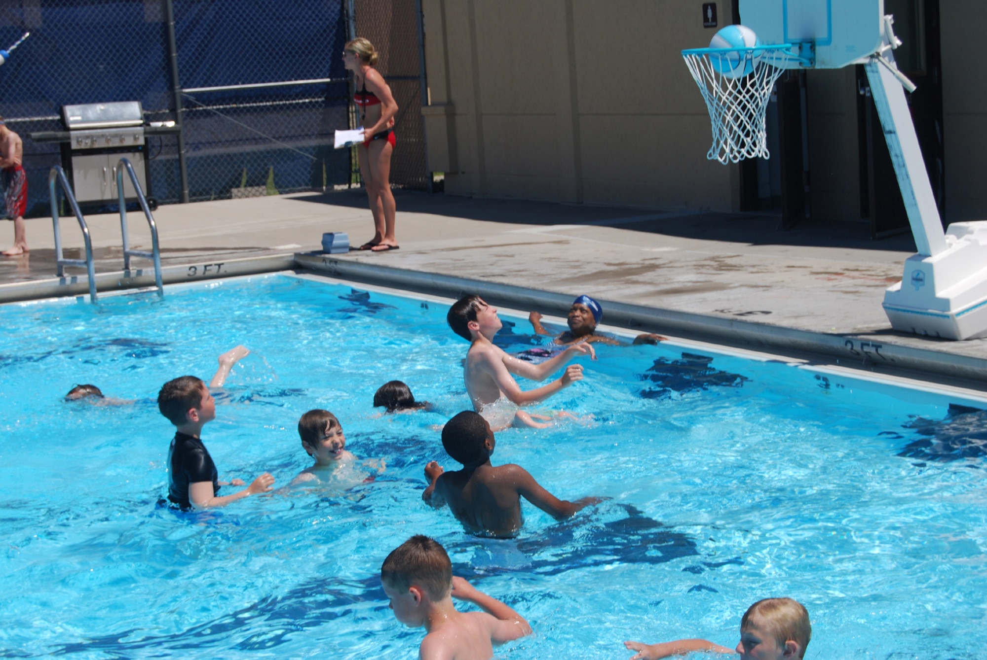 Malmstrom youth enjoy playing a game of basketball in the base pool last season. The base pool is available for open swim Monday through Friday from 1 to 7 p.m. and on weekends from 11 a.m. to 7 p.m. (U.S. Air Force photo/Senior Airman Kristina Overton)