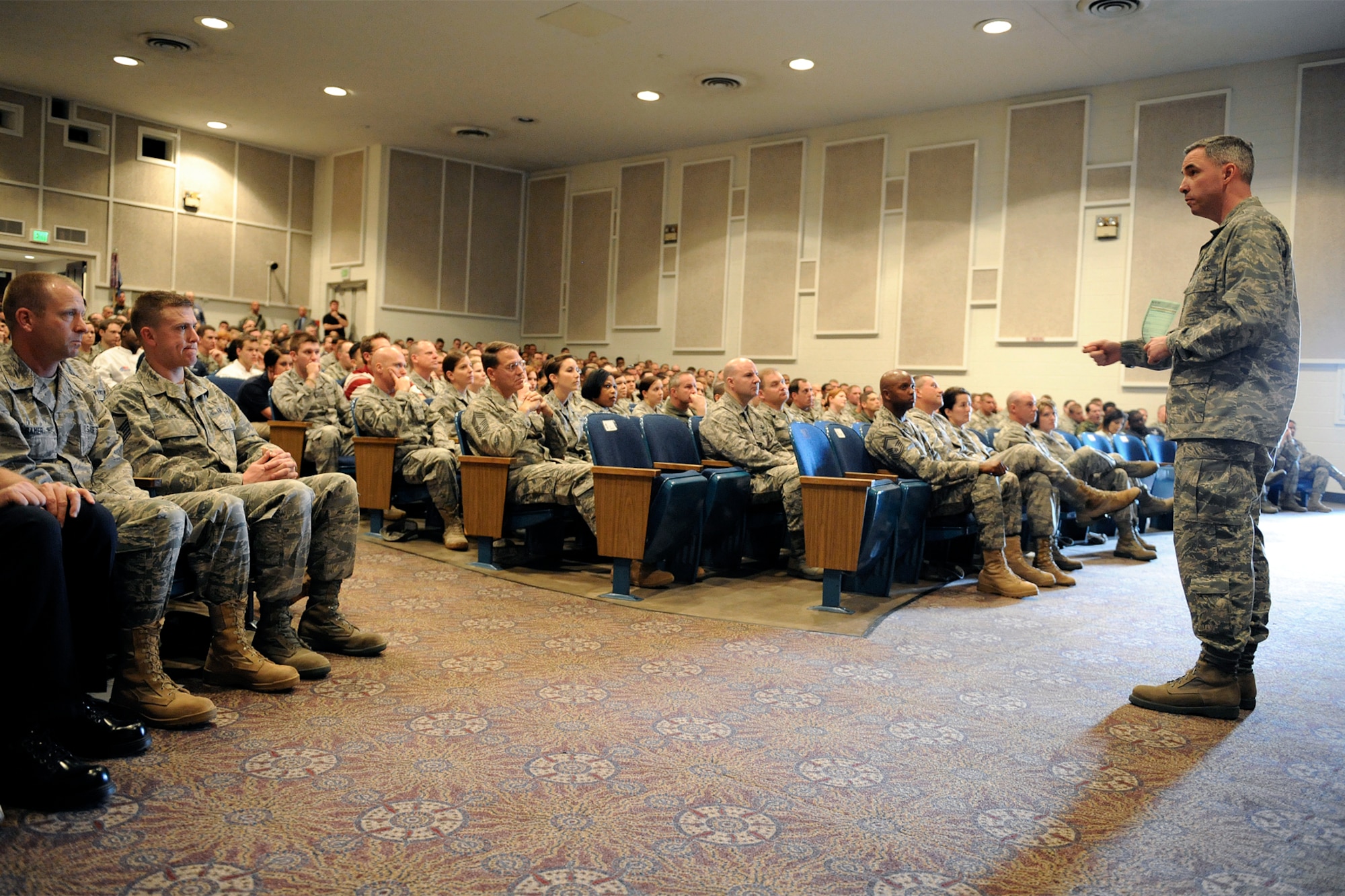 Col. Stephen N. Whiting, 21st Space Wing commander, discusses the importance of sustaining excellence in every aspect of the wing’s operations during his Commander’s Call May 17, 2011, at the base auditorium. Colonel Whiting said this summer will be one of change as Airmen make permanent change of station moves. He urged Airmen and Department of Defense personnel to ensure that they properly hand over their programs and help incoming Airmen understand how they work so that no program falls by the wayside. (U.S. Air Force photo/Craig Denton)