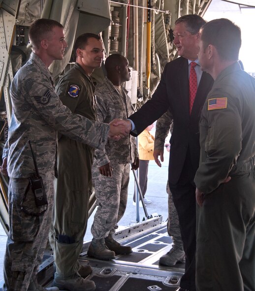Secretary of the Air Force Michael Donley shakes hands with Staff Sgt. Jay Hommerbocker, a 403rd Aircraft Maintenance Squadron maintainer. Secretary Donley and Chief Master Sgt. of the Air Force James Roy visited Keesler Air Force Base, Miss., May 19. During their visit, they had the opportunity to meet 403rd Wing members and tour a WC-130-J aircraft. Also pictured are Tech. Sgt. Jon Carco, a 345th Airlift Squadron loadmaster, and Col. Louis Patriquin, 403rd Operations Group commander. (U.S. Air Force photo by Maj. Heather Newcomb) 
