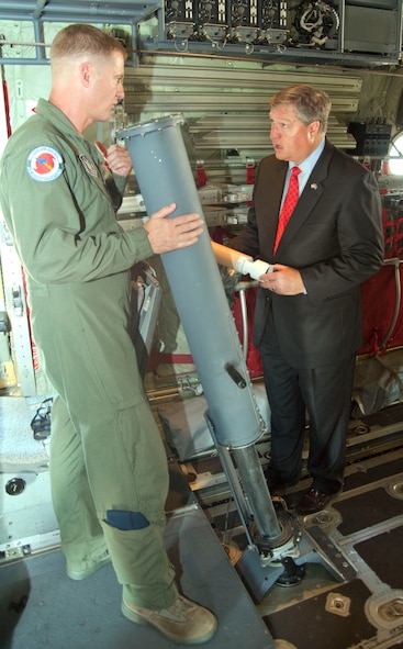 Chief Master Sgt. Richard Cumbo, a 53rd Weather Reconnaissance Squadron loadmaster, explains the use of a dropsonde, which gathers data within a hurricane, to Secretary of the Air Force Michael Donley. Secretary Donley and Chief Master Sgt. of the Air Force James Roy visited Keesler Air Force Base, Miss., May 19, 2011. During their visit, they had the opportunity to meet 403rd Wing members and tour a WC-130-J aircraft.  (U.S. Air Force photo/Maj. Heather Newcomb)